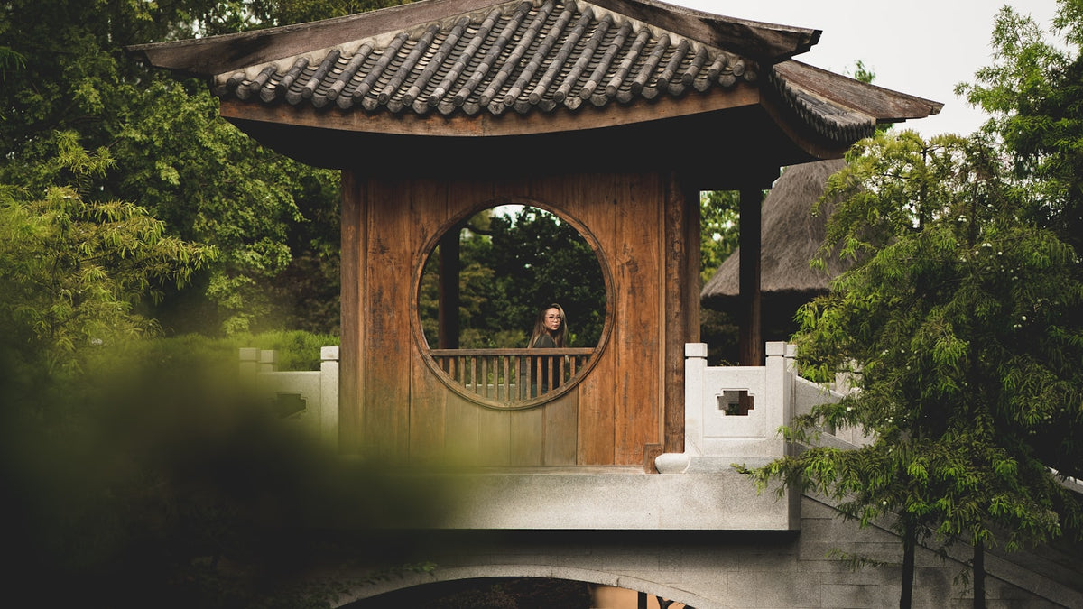 Wooden gazebo structure set up in a backyard