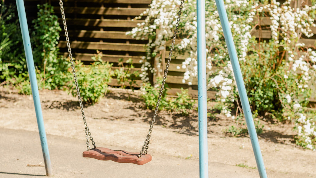 Children's swing set in a backyard